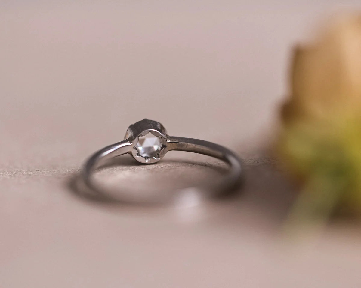 Side view of 4mm rose-cut diamond ring in platinum
