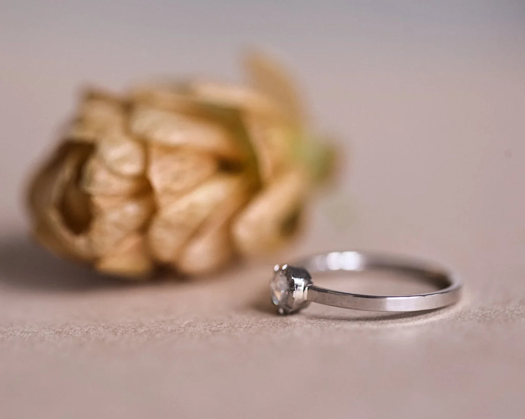 Low front view of platinum rose-cut diamond ring