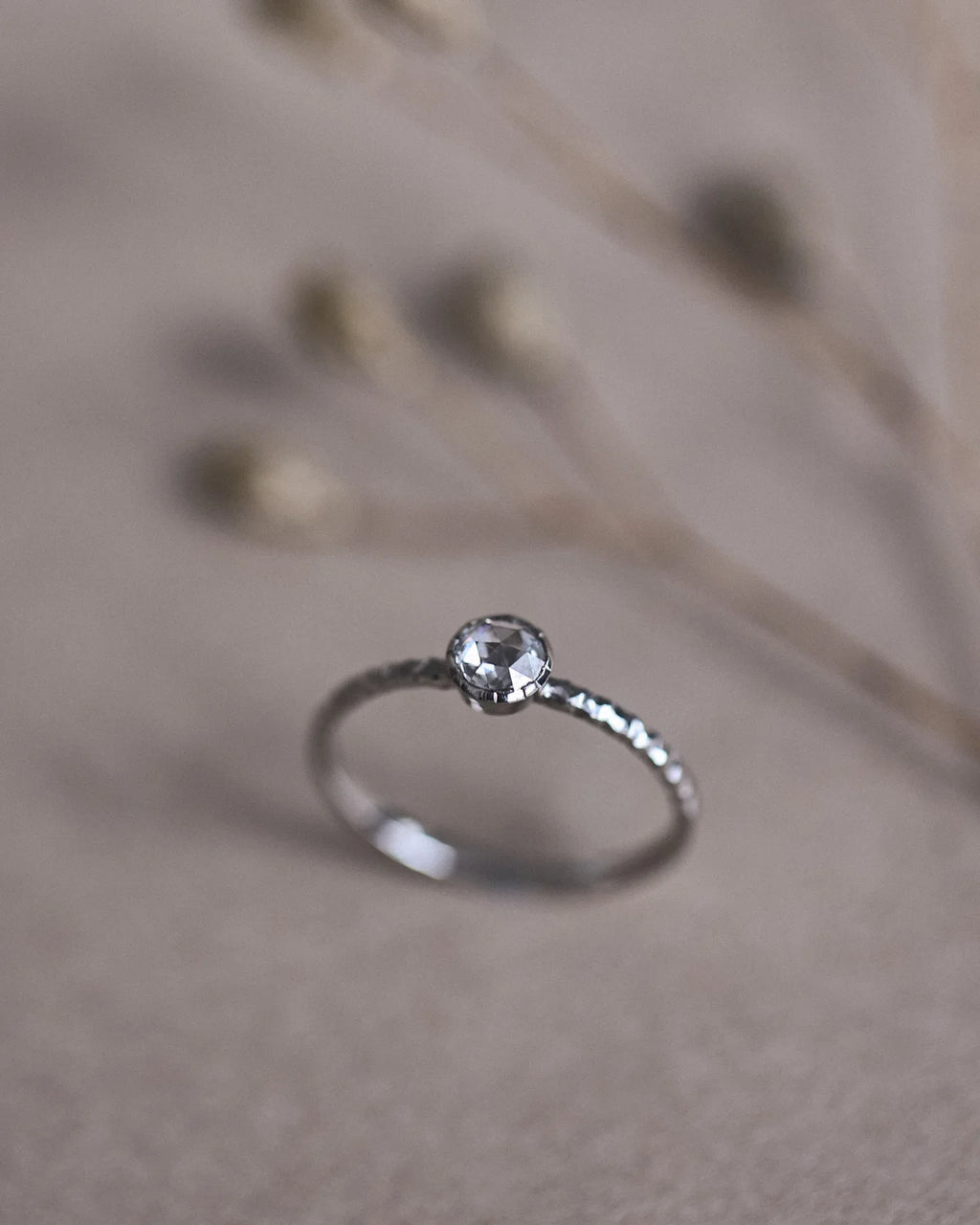 Side profile of platinum rose-cut diamond faceted ring