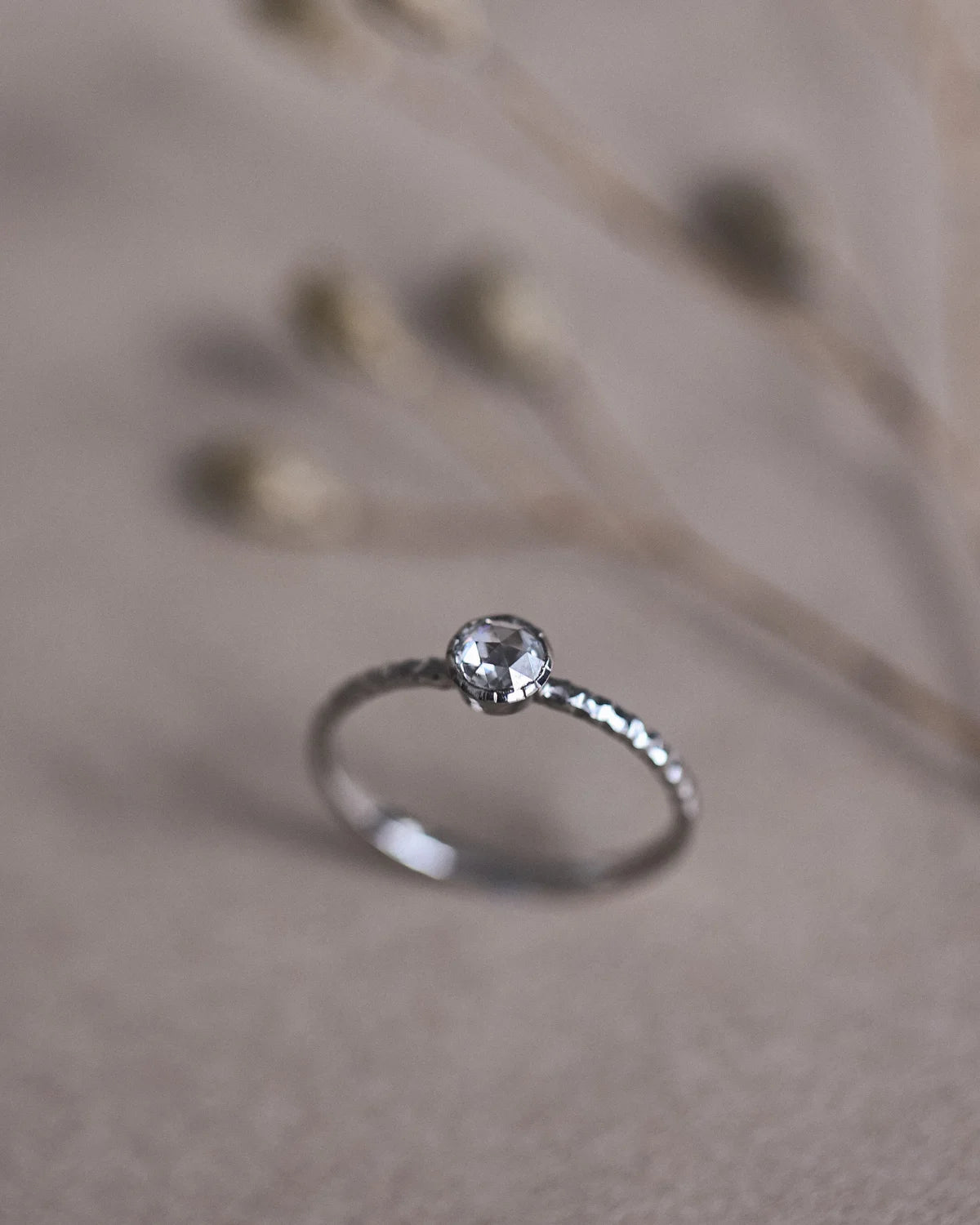 Side profile of platinum rose-cut diamond faceted ring