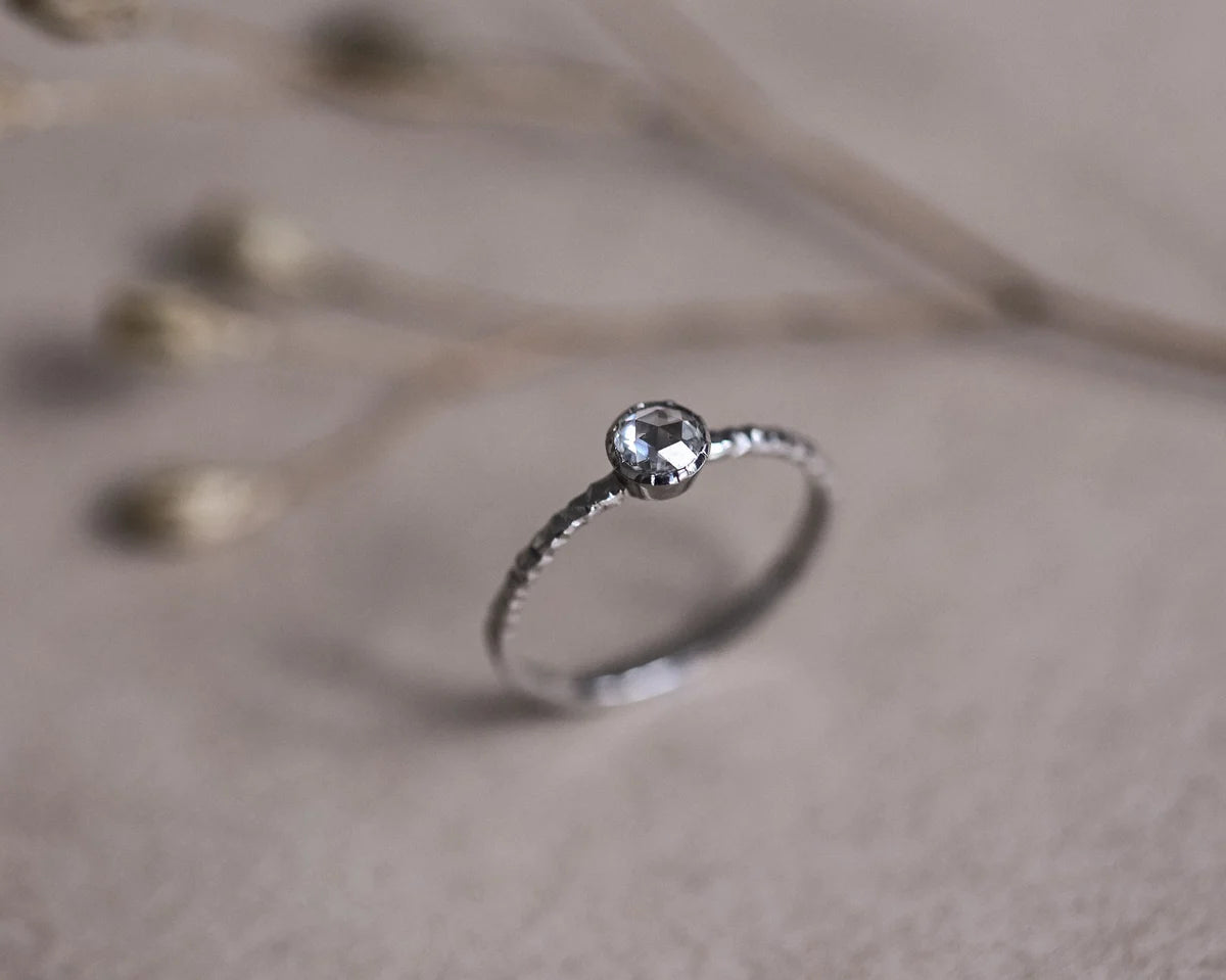 Side view of platinum rose-cut diamond faceted ring