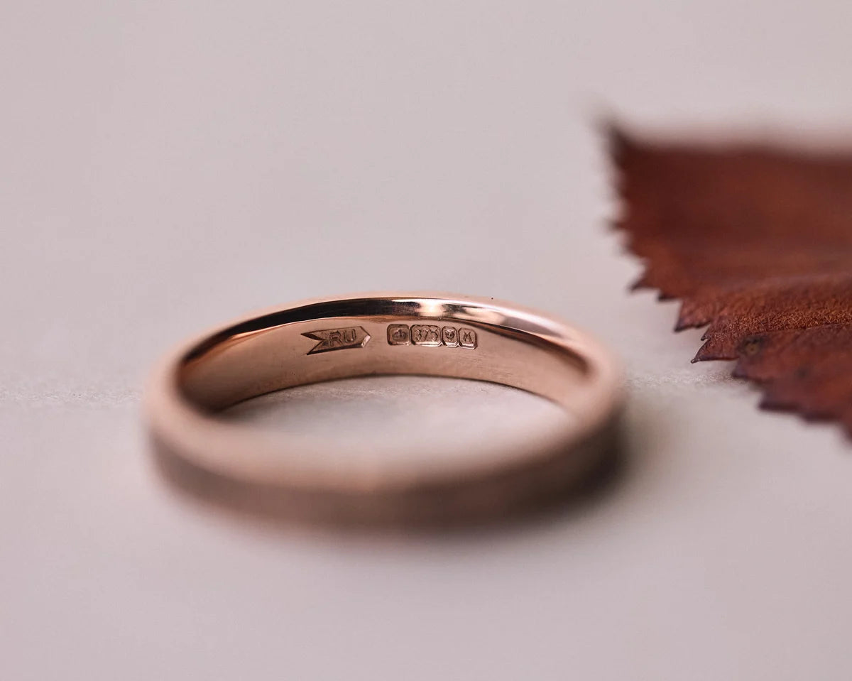 Inside view of 9ct rose gold wedding ring with hallmark
