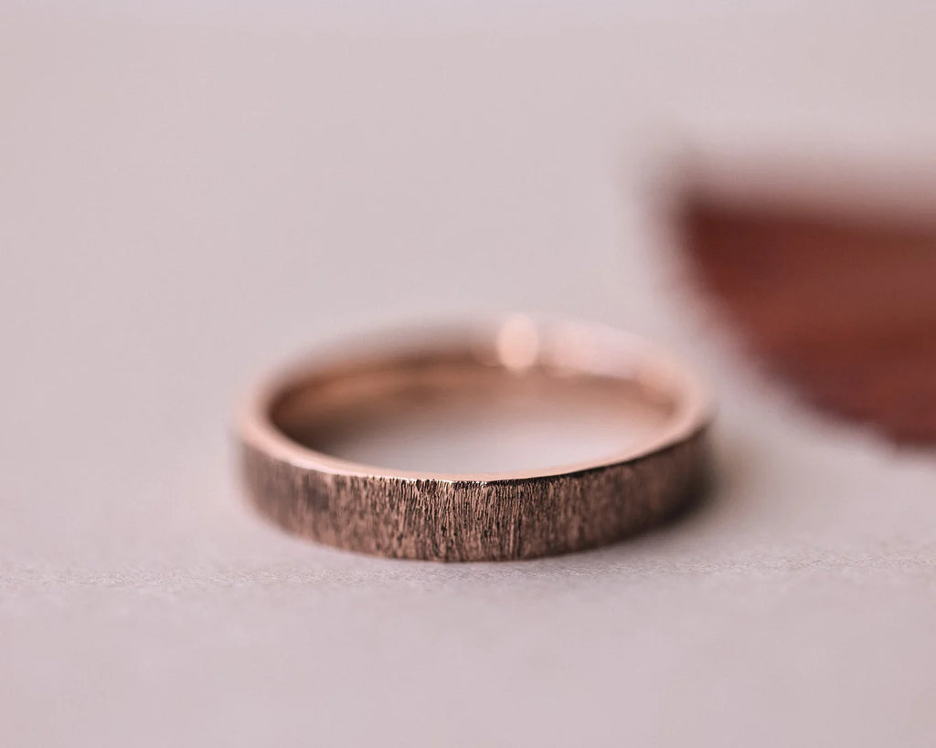 Front view of 9ct rose gold horn texture wedding ring
