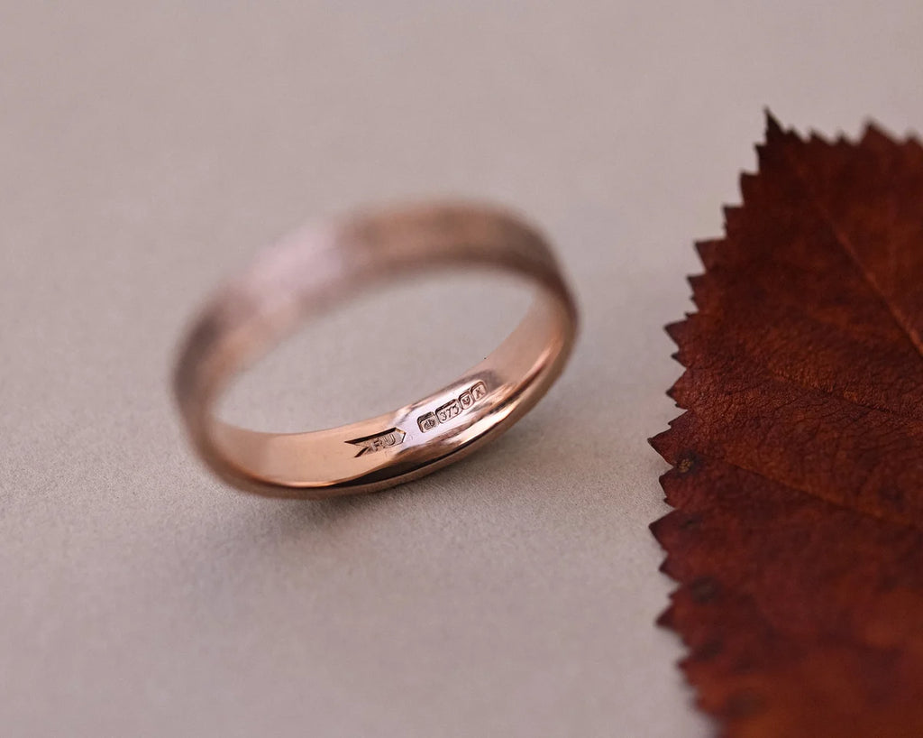Back view of 9ct rose gold flat court wedding ring with smooth interior