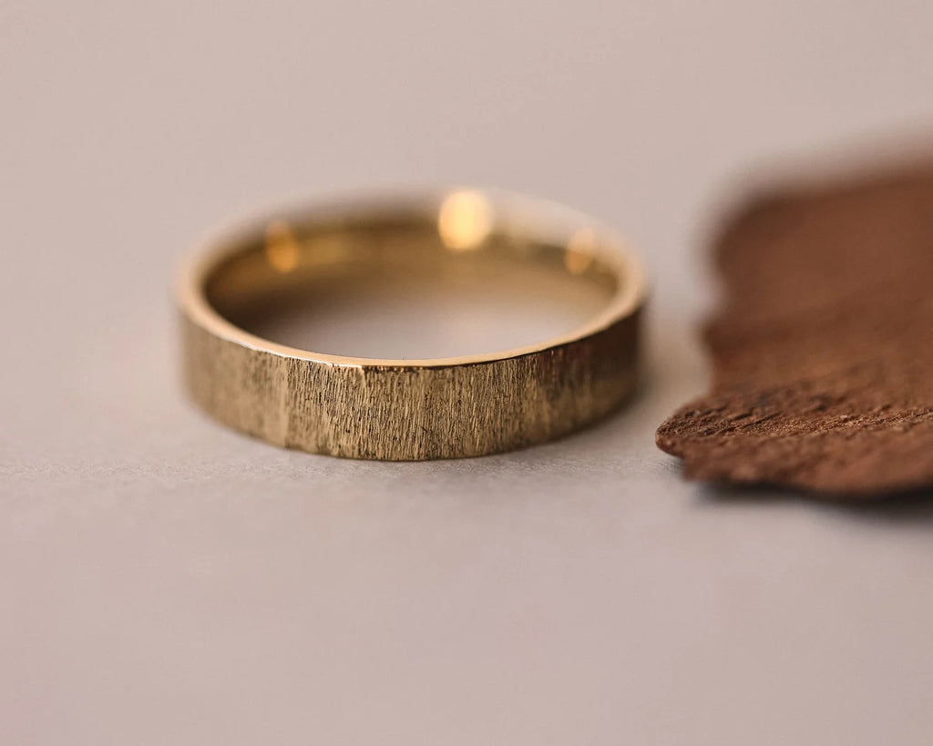 Front view of 18ct yellow gold horn texture wedding ring