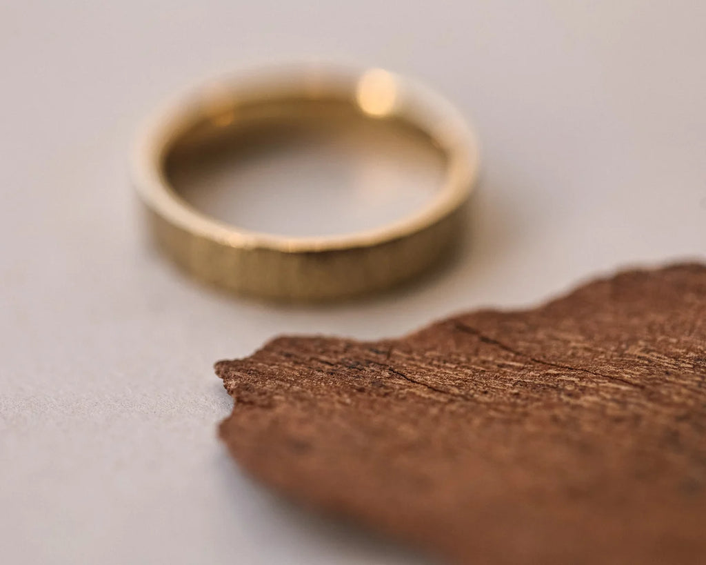 18ct yellow gold flat court ring with hand finished horn texture