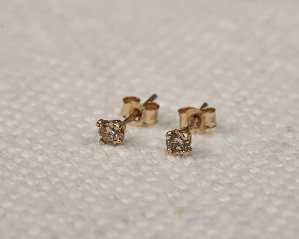 claw setting detail champagne diamond earrings 9ct gold