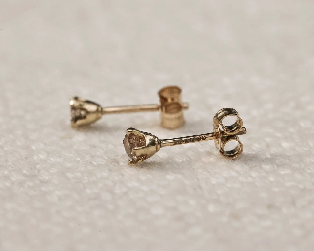 butterfly back detail gold diamond stud earrings