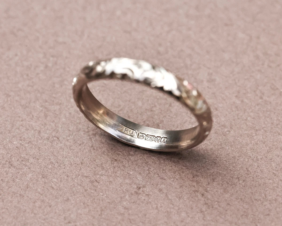 Inside view of 18ct white gold floral engraved ring with hallmark
