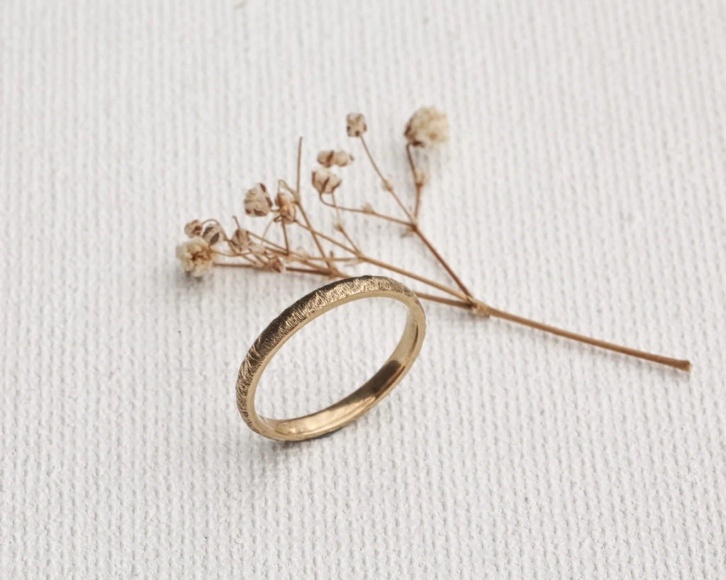 organic gold wedding band horn texture minimalist design