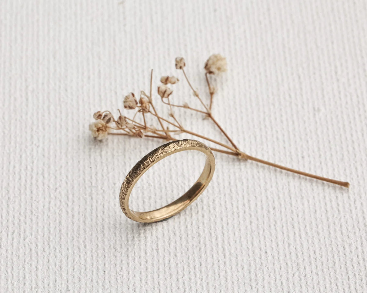 organic gold wedding band horn texture minimalist design