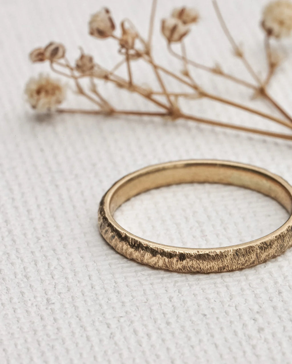 understated gold ring organic texture detail