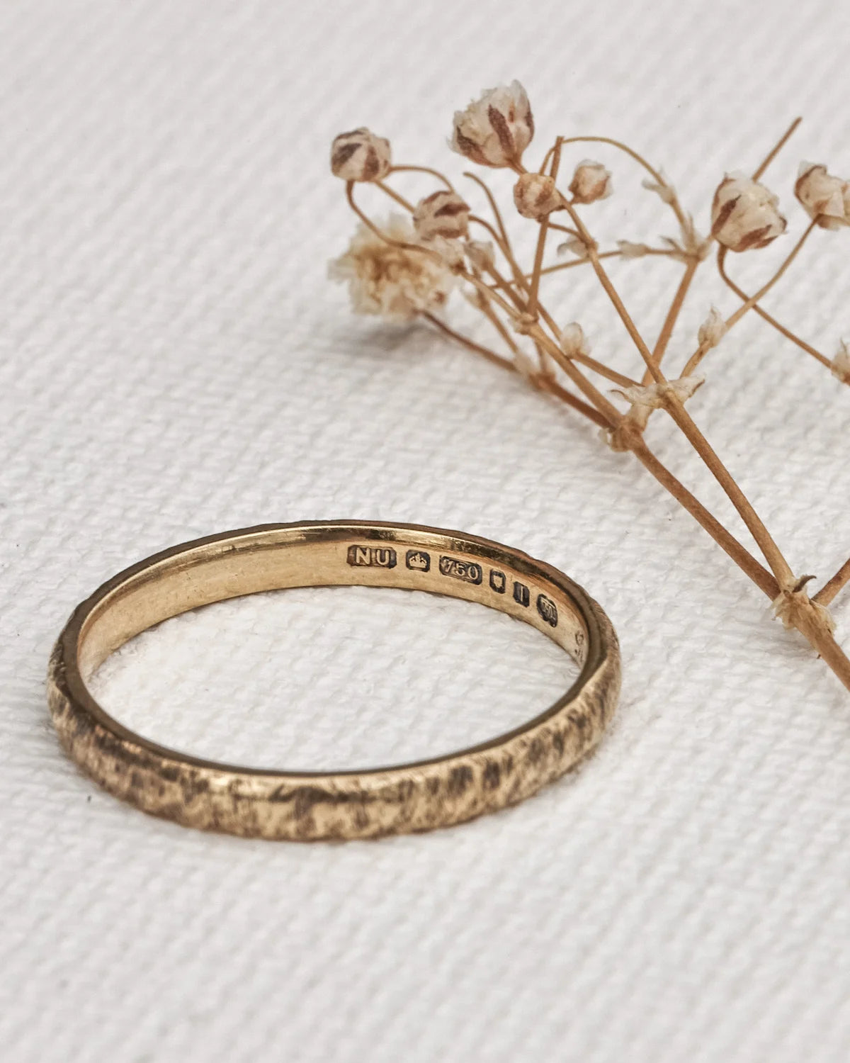 soft shine gold ring with horn texture close up