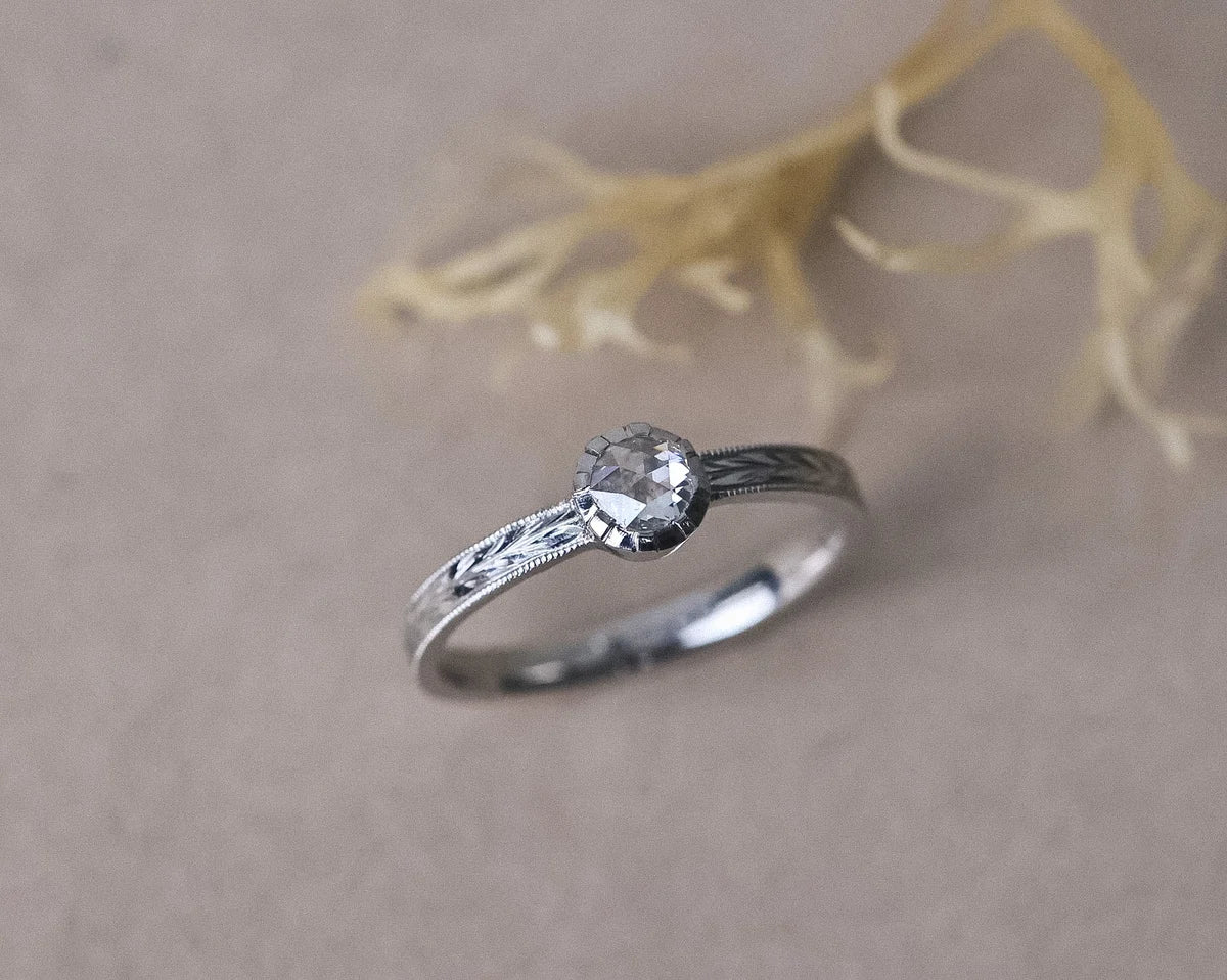 Handmade platinum rose-cut diamond ring with olive leaf engraved band