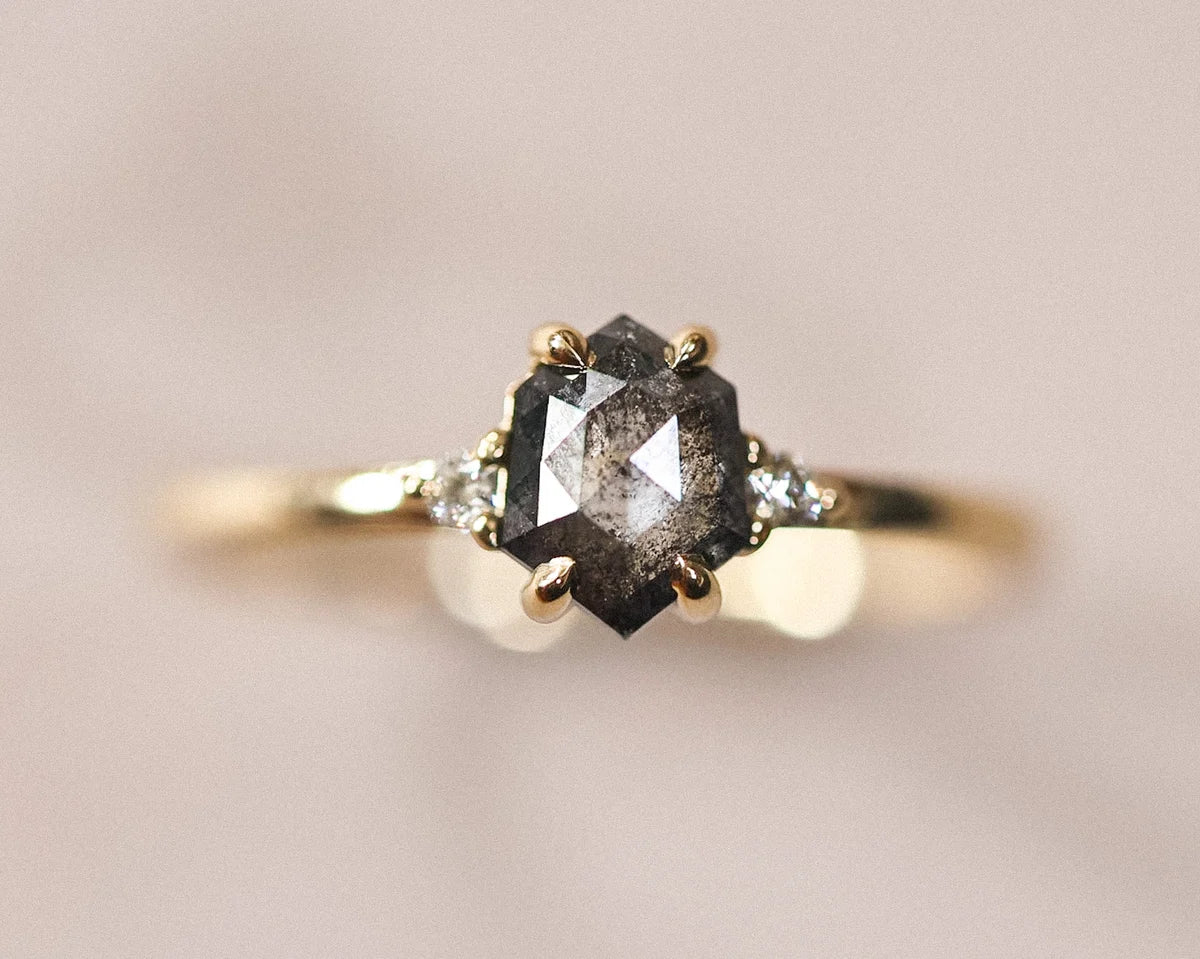 18ct yellow gold trilogy ring with grey rose-cut hexagonal diamond and white diamond shoulders