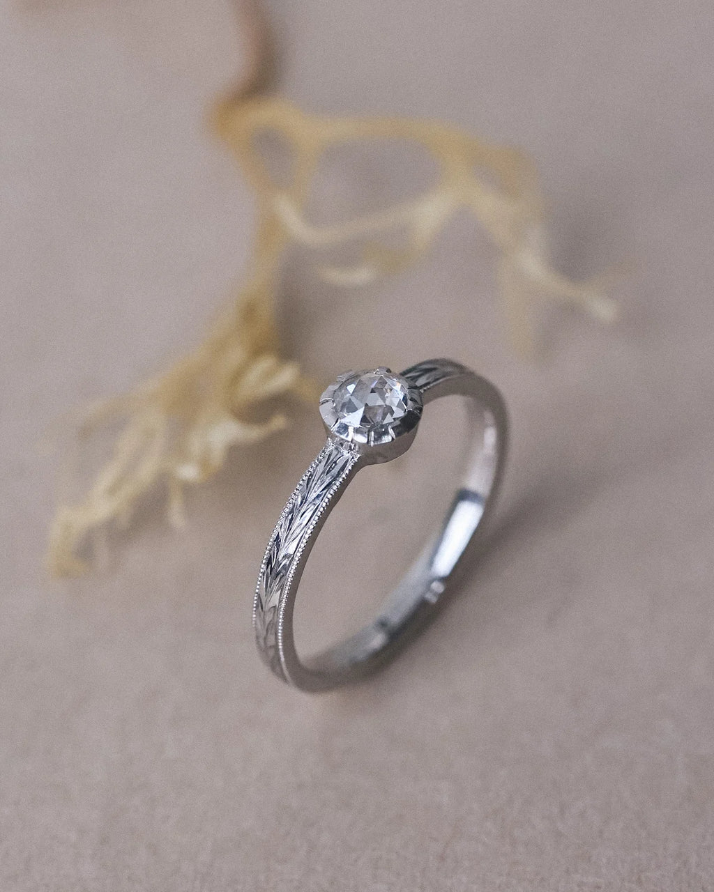 Rose-cut white diamond ring with olive leaf engraved band