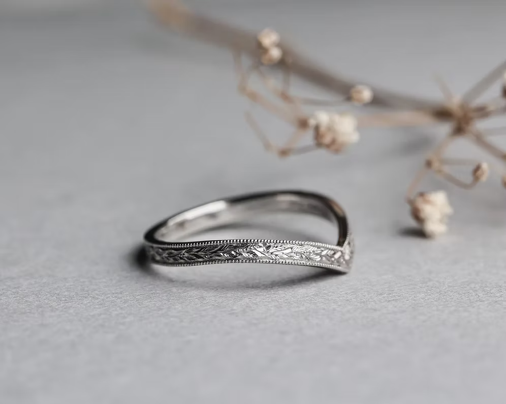 wishbone wedding ring worn with engagement ring platinum band