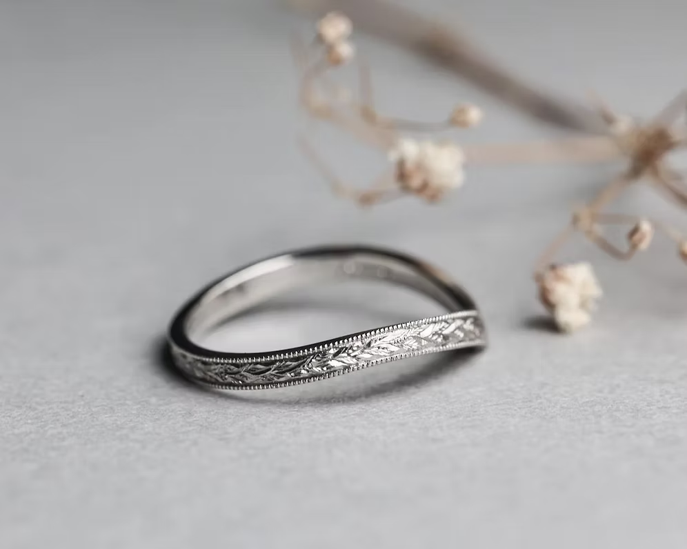 wishbone wedding ring worn with engagement ring platinum band