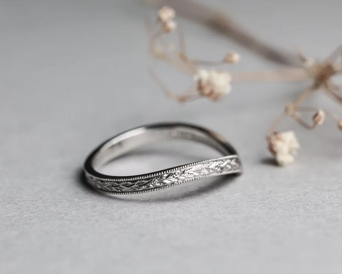 wishbone wedding ring worn with engagement ring platinum band