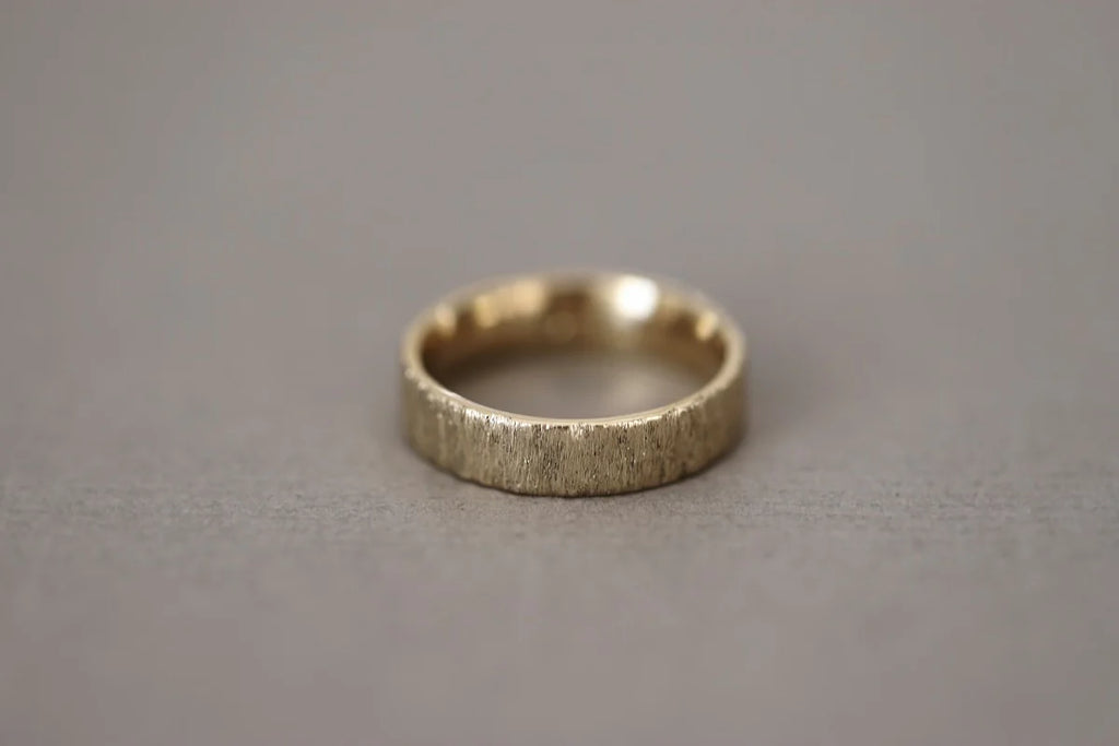 Silver ring on a gray background