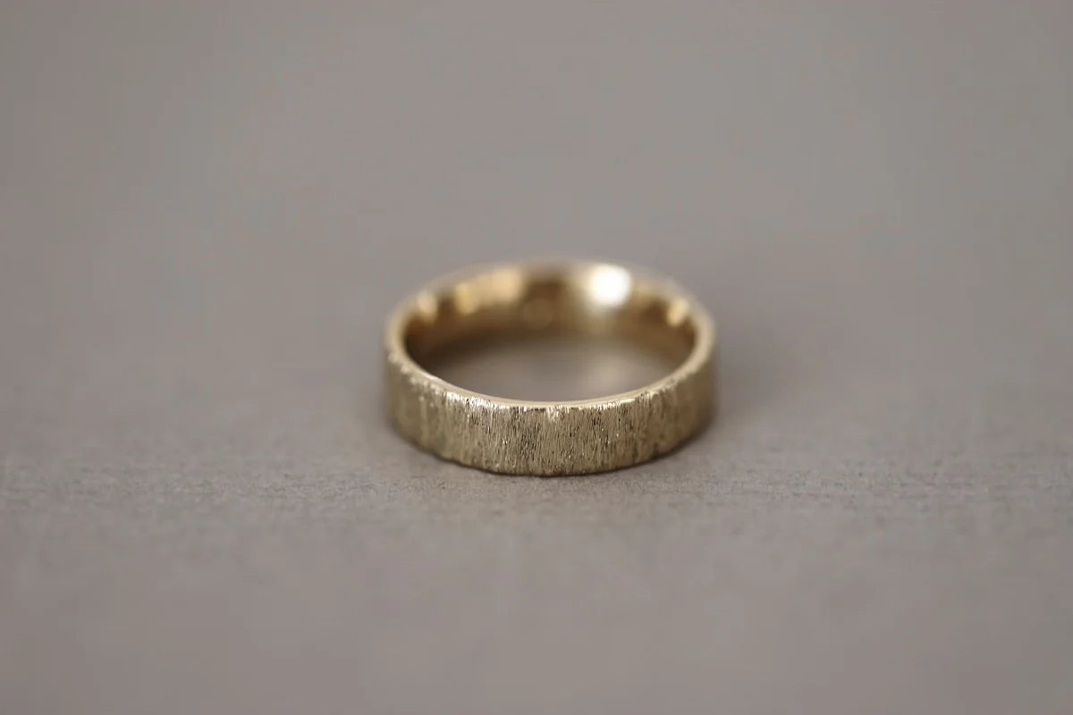 Silver ring on a gray background