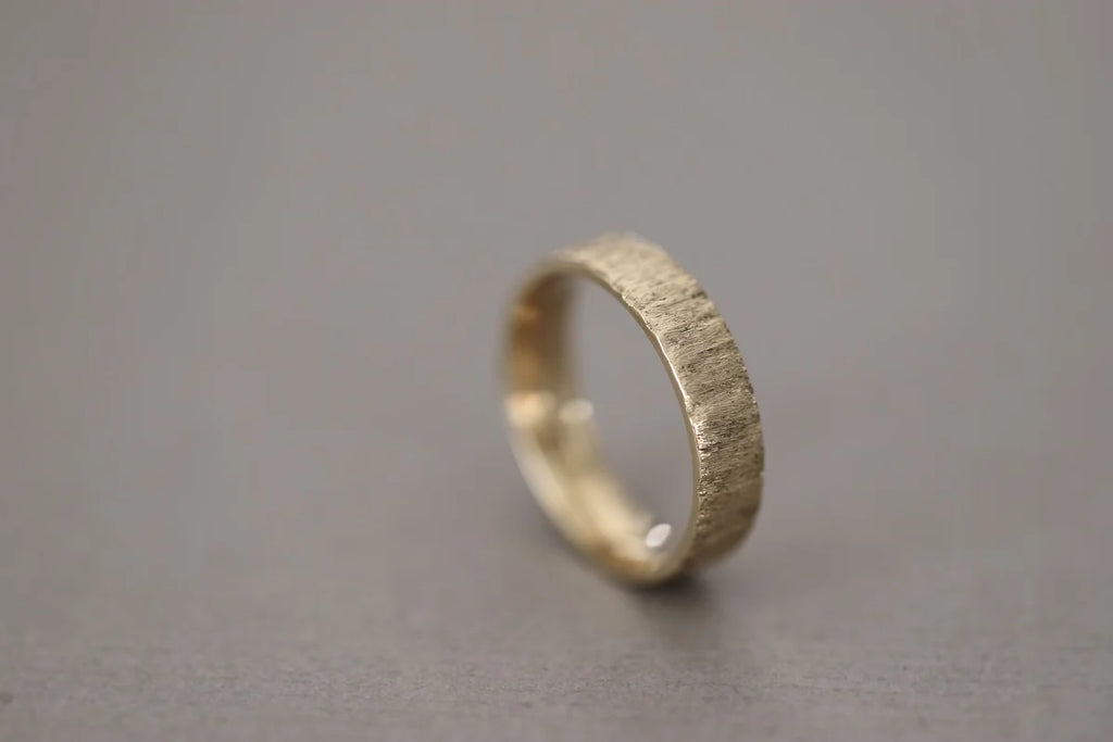 organic textured finish gold band wedding ring detail
