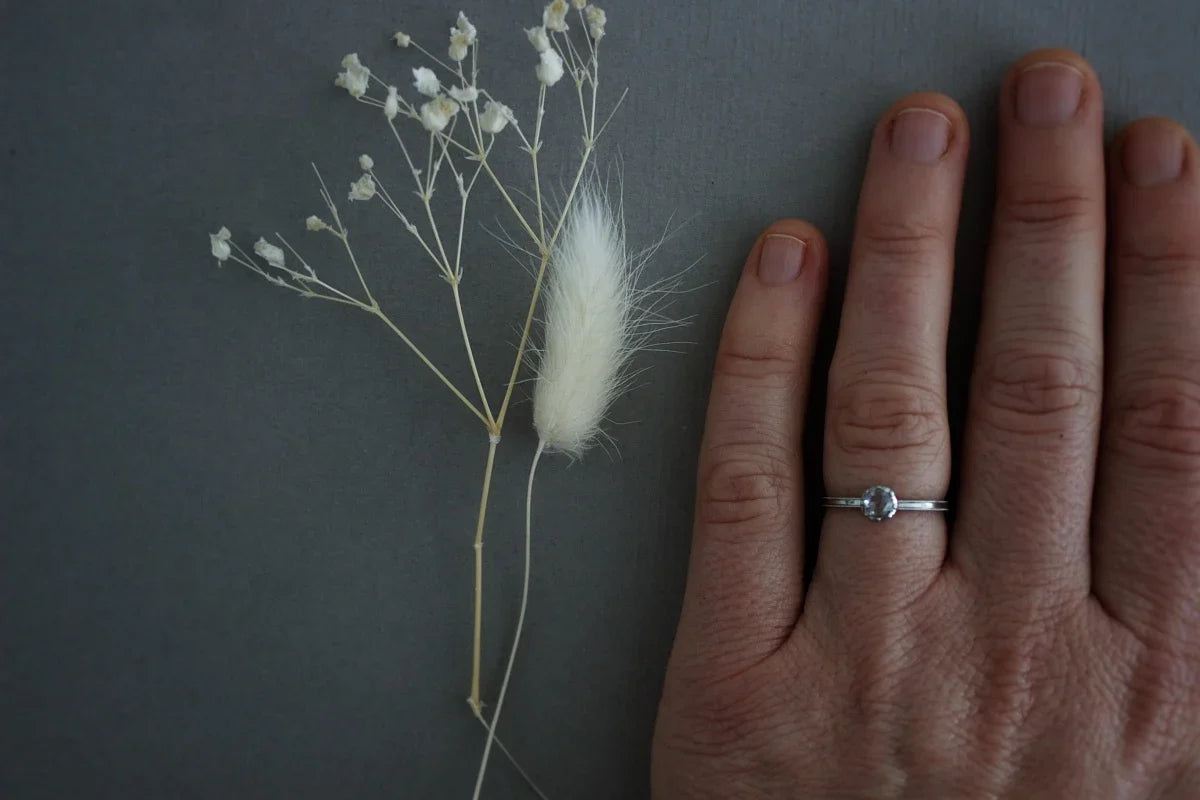 rose cut diamond ring worn on hand platinum band