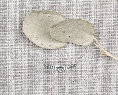 fine diamond setting detail platinum wishbone ring