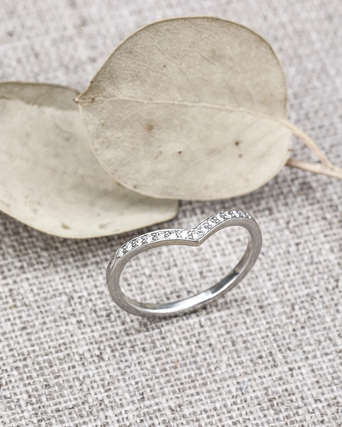 fine diamond setting detail platinum wishbone ring