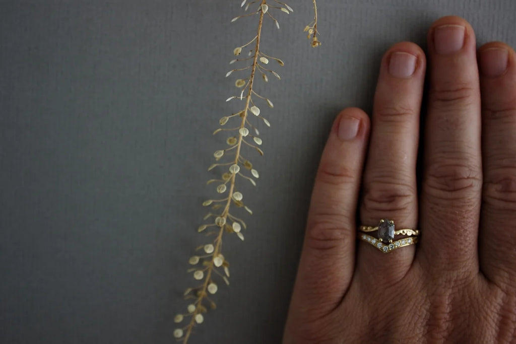 White diamond wishbone semi-eternity ring worn on hand